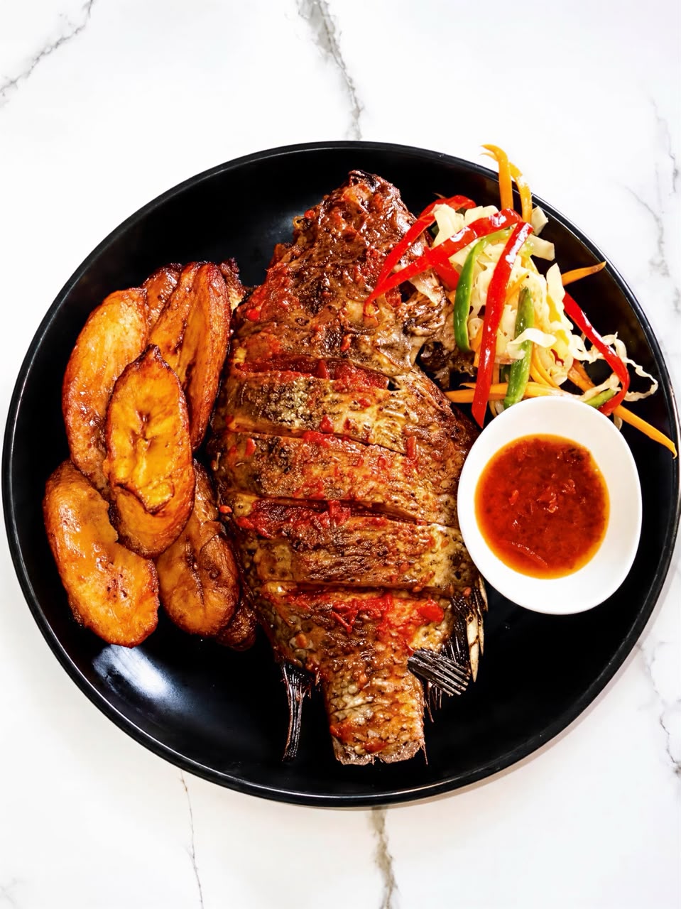Tilapia fish served with a choice of side